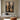 Abstract oil painting of symmetrical hourglass forms with woodgrain textures in beige and brown tones, transitioning to black gradient background.  