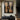 Abstract oil painting of symmetrical hourglass forms with woodgrain textures in beige and brown tones, transitioning to black gradient background.  