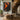 Abstract oil painting of a human figure in black silhouette with fiery orange brushstrokes