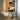 "Chromatic Muse" abstract portrait painting of a face in profile using bold blocks of orange, blue, black, and white with red lips, in a modern graphic style.
