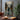 Original abstract oil painting of woman walking through misty city street with orange lights, hand-painted art with cinematic urban emotion