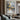 Metallic abstract cityscape painting with golden lights and water reflections