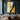 minimalist abstract oil painting with flowing gold, black, and grey shapes in vertical composition, modern decorative wall art with sculptural energy