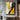 minimalist abstract oil painting with flowing gold, black, and grey shapes in vertical composition, modern decorative wall art with sculptural energy