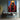 Bold Figurative Oil Painting of a Woman in Red Blue and Yellow Spotlight