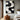 Abstract oil painting with flowing white textured lines on black background