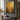 Abstract gold oil painting with raised grid texture and charcoal accents on stretched canvas, creating light-reflective metallic effects.  