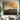Original oil painting of mountain range with gold accents and textured sky in earthy tones