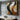 Abstract geometric oil painting with flowing golden, black and beige wave-like forms