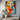 "Inner Hues" abstract portrait oil painting of a face with closed eyes, rendered in bold blocks of orange, teal, and white with red lips and dark expressive lines.
