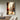 Hand-painted impressionist oil painting of a woman in white sitting on a Paris street with the Eiffel Tower, romantic golden tones and poetic urban scene