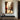 Hand-painted impressionist oil painting of a woman in white sitting on a Paris street with the Eiffel Tower, romantic golden tones and poetic urban scene