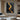 Minimalist Black and Gold Curved Line Painting with Textured Abstract Design