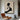 Hand-painted minimalist oil painting depicting a woman's profile silhouette in smooth black curves, contrasted against a textured ivory background with cream undertones and subtle brushstroke textures.?