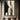 Abstract handmade oil painting of two mirrored profile silhouettes in black and beige