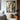 Abstract oil painting with layered wooden panels, geometric shapes, and textured transitions between beige and gray tones.  