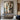 Abstract oil painting with layered wooden panels, geometric shapes, and textured transitions between beige and gray tones.  