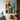 "Neon Velocity" abstract oil painting in a pop art and graffiti style, featuring vibrant streaks of neon-like colors (yellow, red, blue) over a dark, abstracted urban background.
