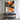 "Orange Burst Abstract" oil painting in black, white, and grey, featuring bold, textured abstract forms dramatically accented with large areas of vibrant orange/red.
