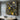 Pollock-style drip painting with yellow and white splashes on black background