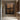 Original geometric abstract oil painting "Quadra Panels" depicting four textured brown rectangular panels against a dark background, creating a modern, structured look.
