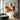 minimalist abstract painting of a seated woman in warm beige and brown tones