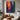 abstract expressionist oil painting of silhouette figure between red and blue city lights, modern vertical canvas with emotional color contrast