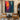 abstract expressionist oil painting of silhouette figure between red and blue city lights, modern vertical canvas with emotional color contrast
