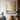 Abstract oil painting mimicking organic wall surfaces with layered beige and gray brushstrokes, rough textures transitioning from light to dark tones.  