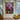 Hand-painted pop art graffiti-style canvas of cartoon toy figure with crossed eyes and pink X symbol, vibrant and rebellious wall artwork