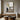 Minimalist abstract painting with a lone figure in a soft gray and beige city scene