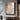 Oil painting replicating vintage wall texture with peeling beige plaster, ochre patina stains, and charcoal crack details on raw canvas.  