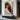 Warm Hand-Painted Figurative Oil Painting of Girl Hugging Black Cat