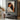 Warm Hand-Painted Figurative Oil Painting of Girl Hugging Black Cat
