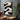 Textured abstract minimalist painting with winding black and white curves